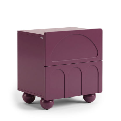 Purple modern side table on a white background with geometric drawer fronts and spherical legs