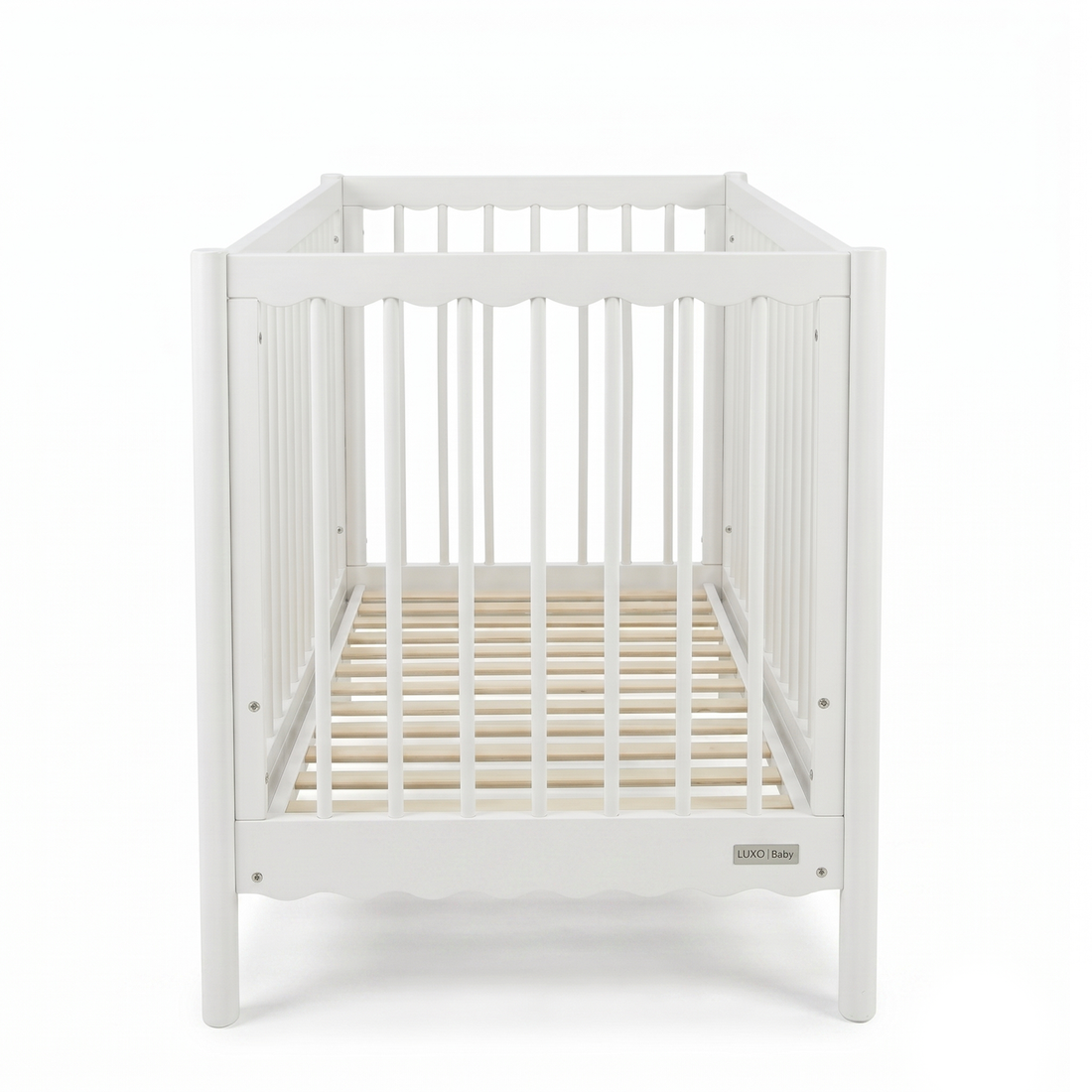 Front view of white wooden baby crib on a white background