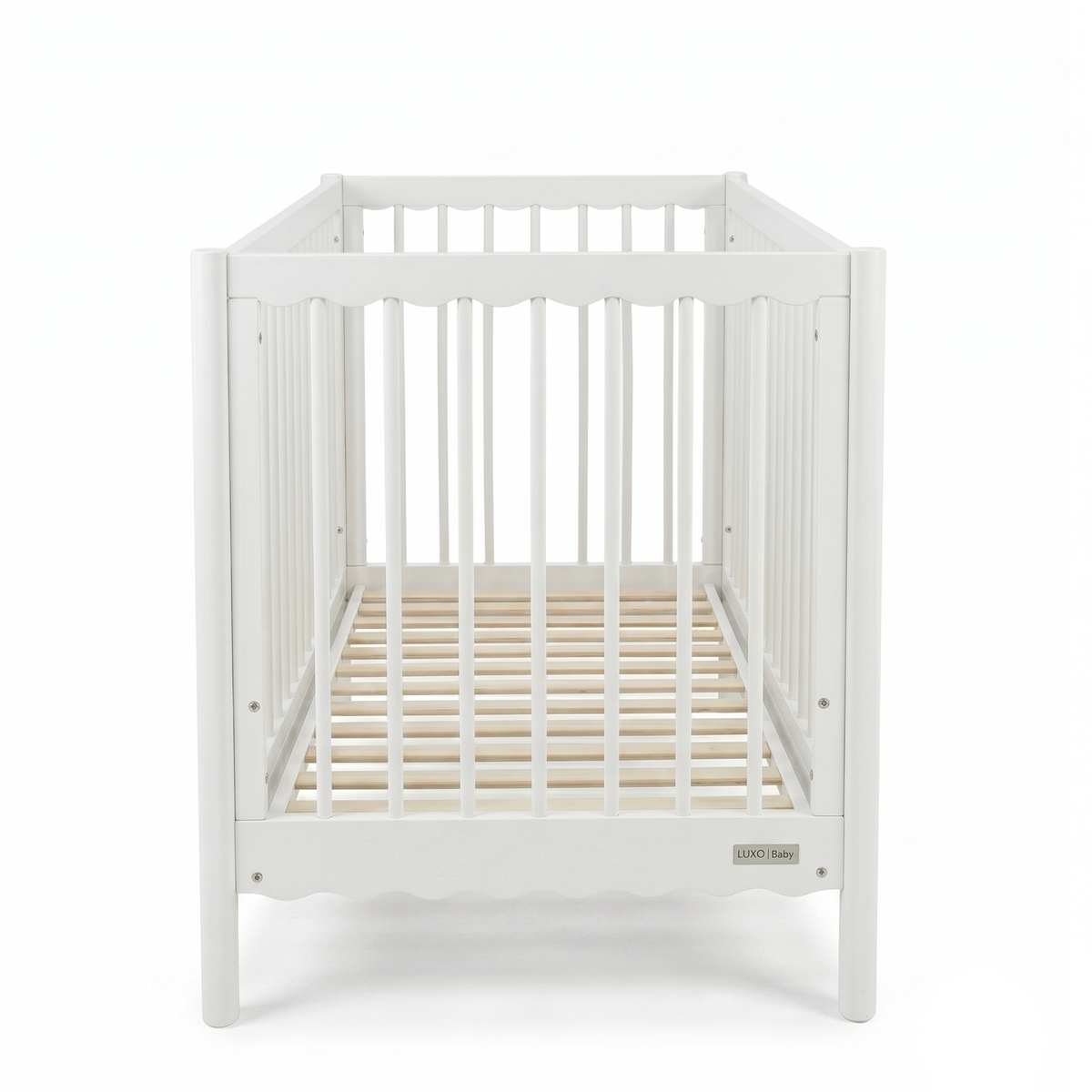 Front view of white wooden baby crib on a white background