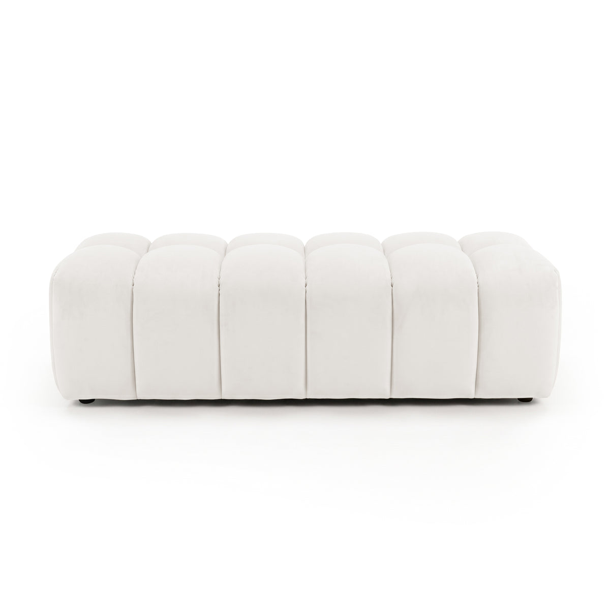 Light beige upholstered panel-tufted ottoman bench on a white background