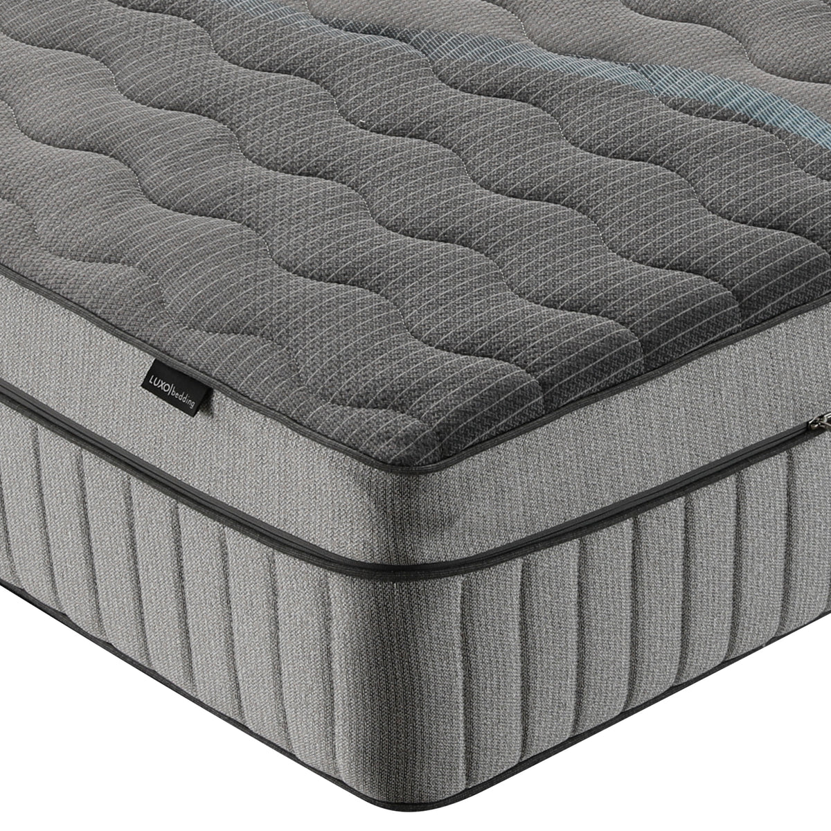 Close-up of mattress corner on white background