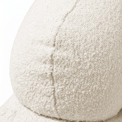 Close-up of off-white boucle fabric texture on white background