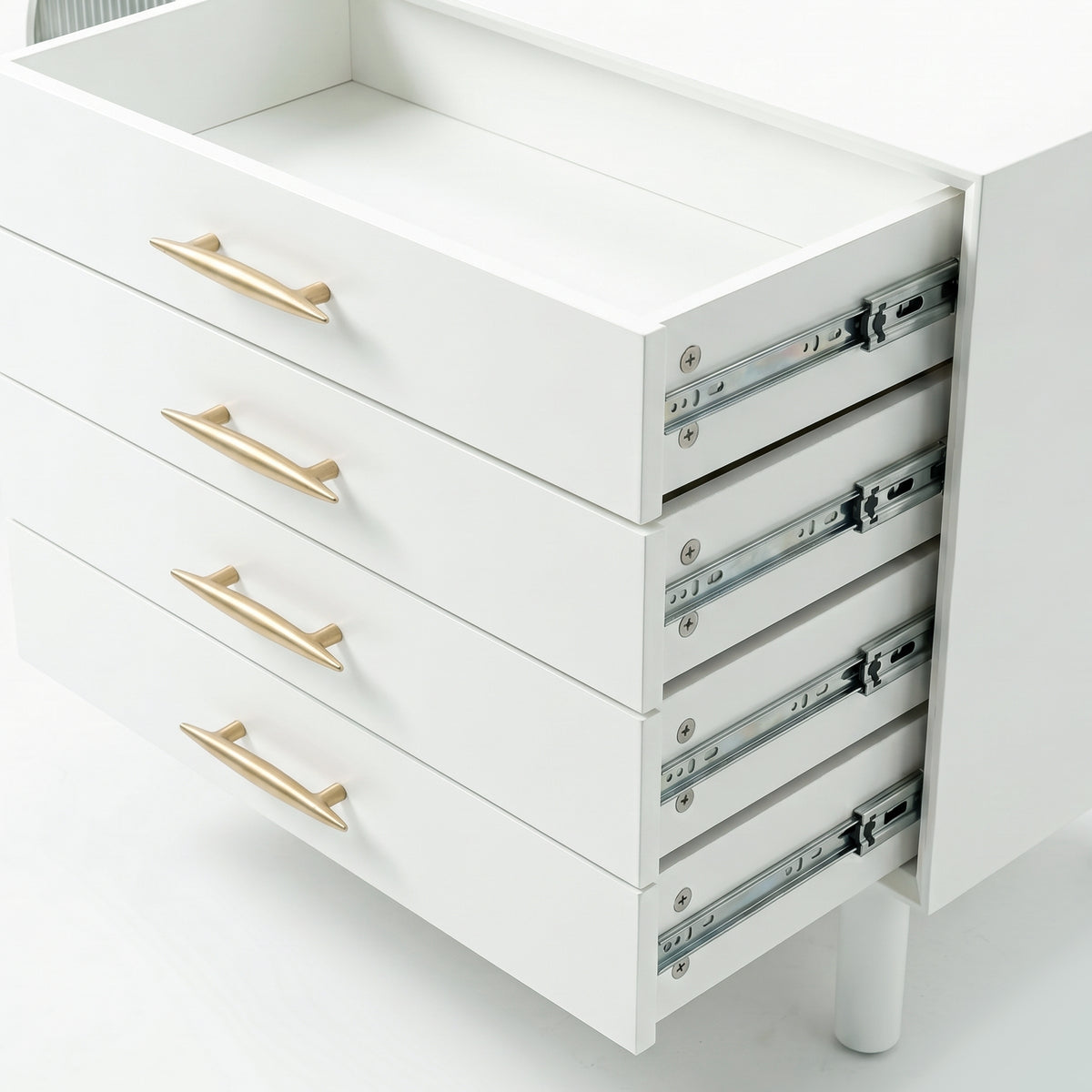 Close-up of white cabinet drawers with gold handles and visible metal slides on white background