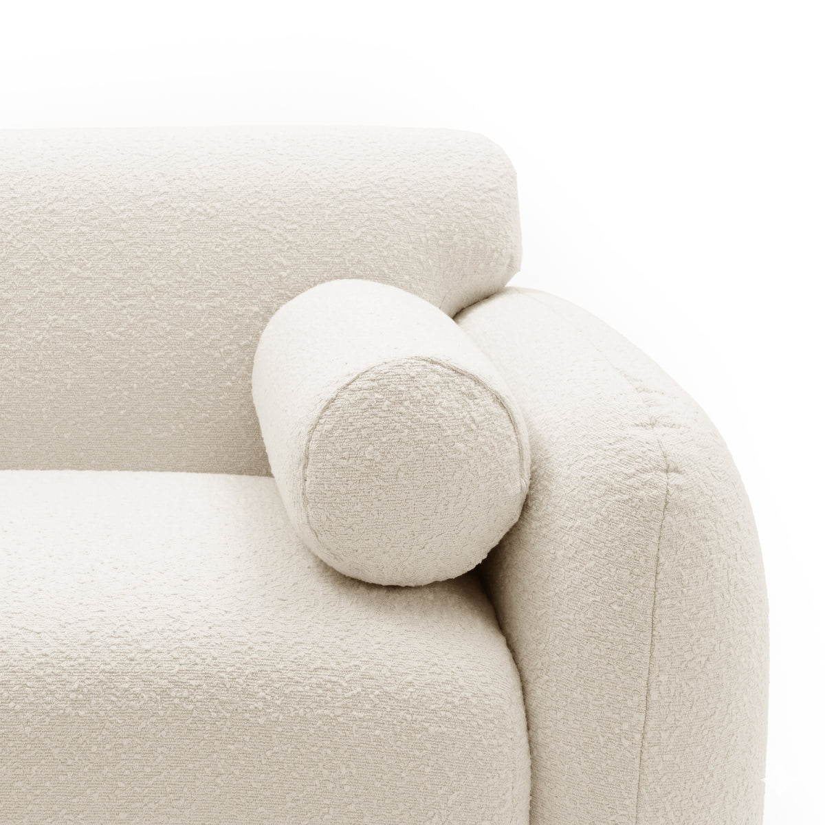 Close-up of off-white upholstered chair armrest and bolster pillow on white background