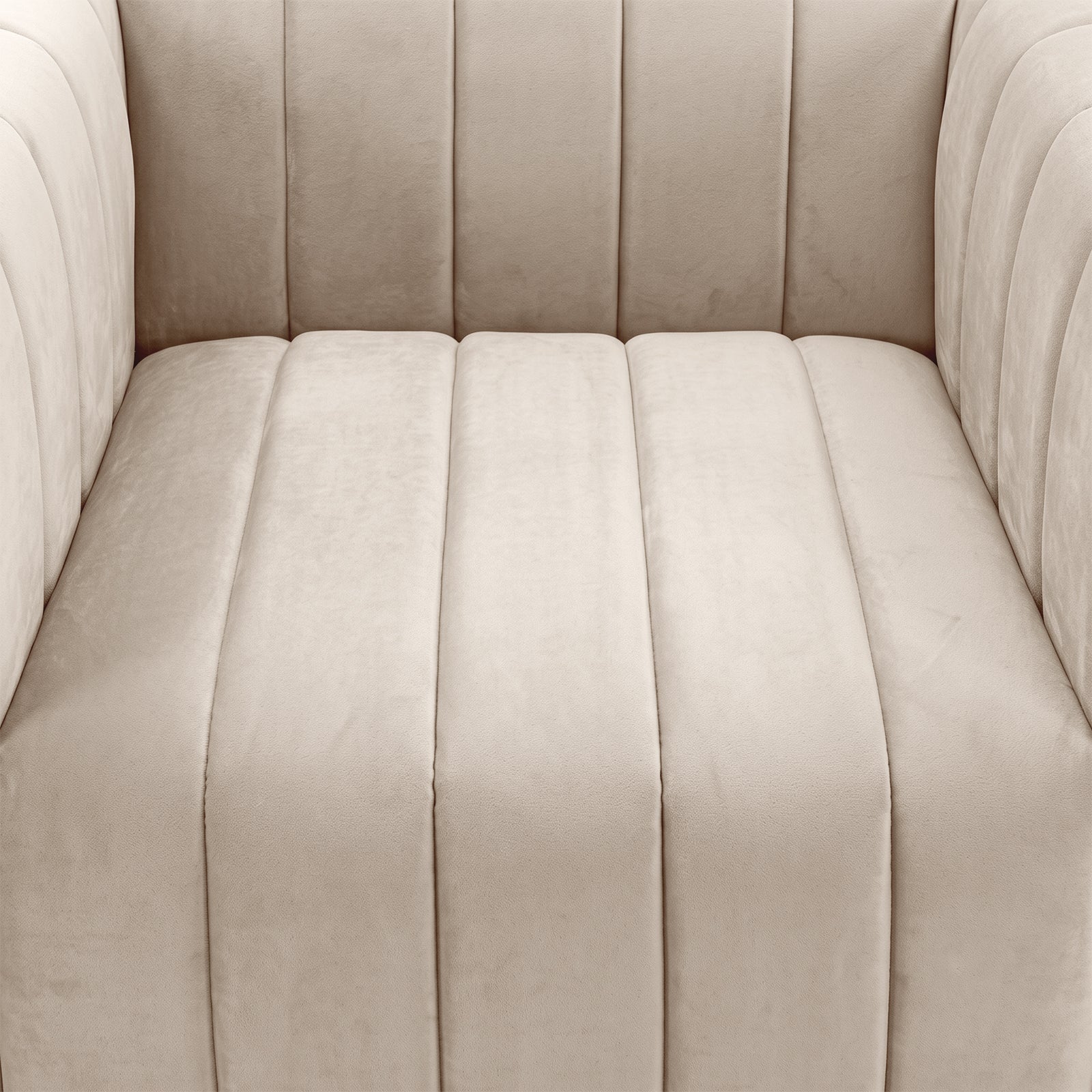 Close-up of beige upholstered seat and armrests with vertical channel tufting