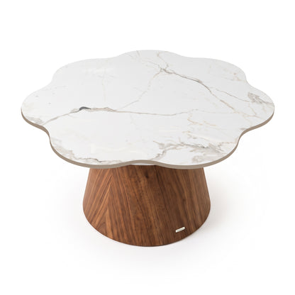 Flower-shaped coffee table with white marble top and wooden base on white background