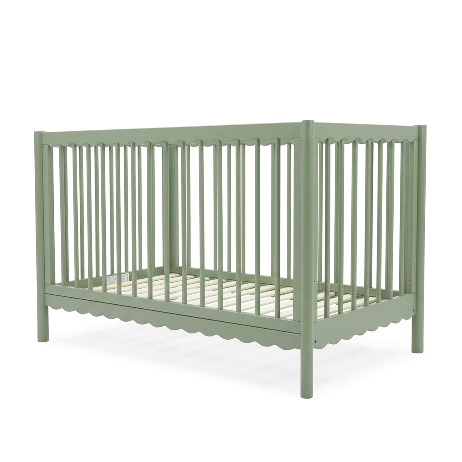 Angled view of sage green baby crib on white background