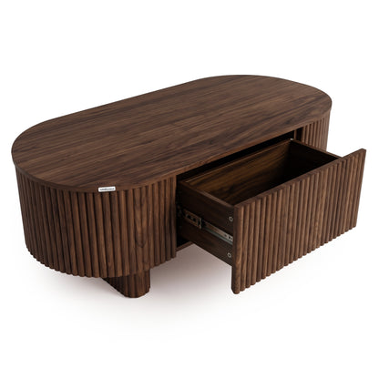 Oval dark wood coffee table with a partially open drawer on a white background