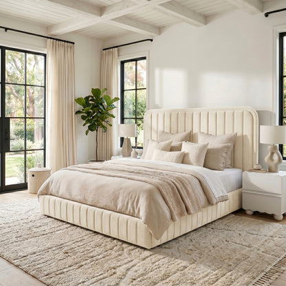 Upholstered bed in modern bedroom with nightstands and lamps
