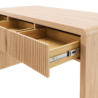 Close view of a wooden desk corner with an open drawer on a white background.