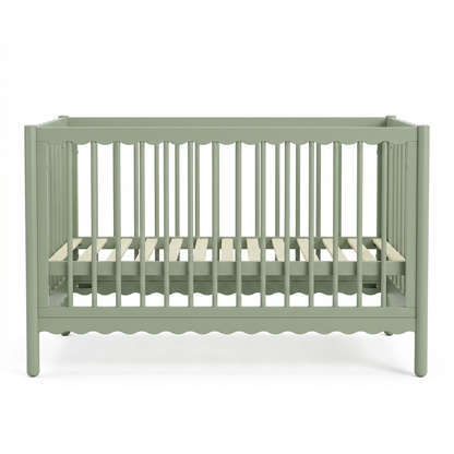 Full-view of sage green baby crib on white background
