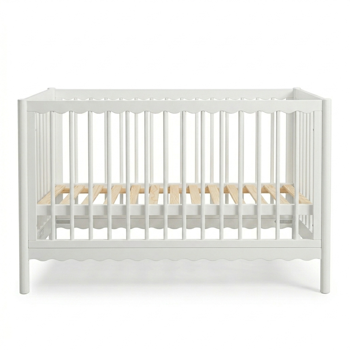 White crib with natural wood slats on a white background