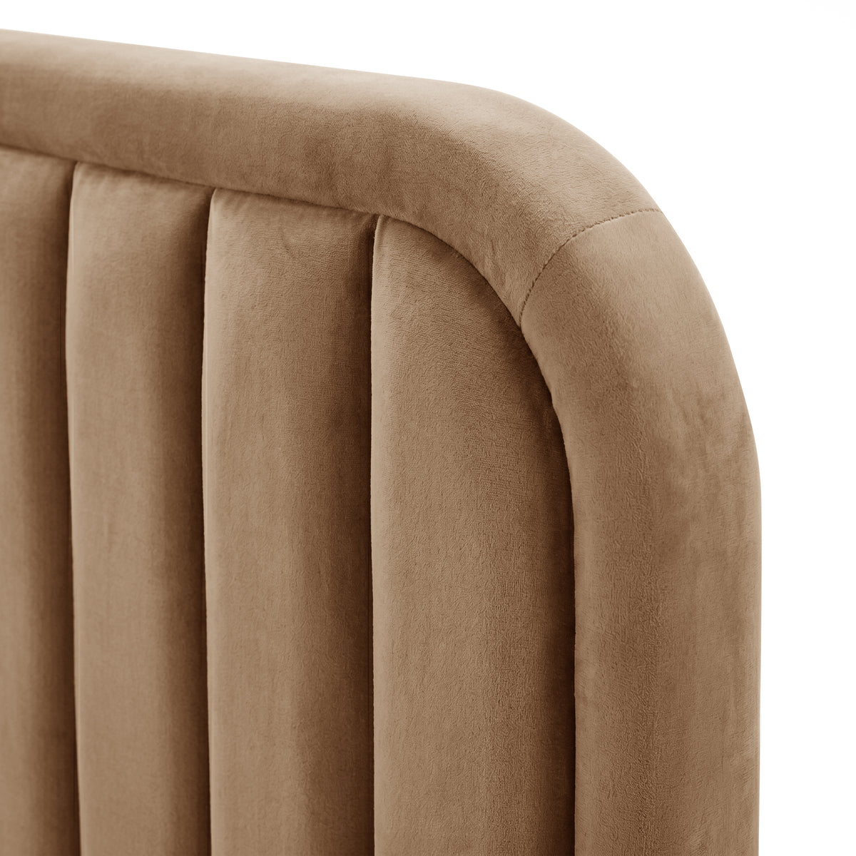 Close-up of tan velvet headboard channel tufting