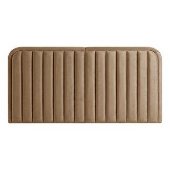 Tan upholstered headboard with vertical channel tufting on white background