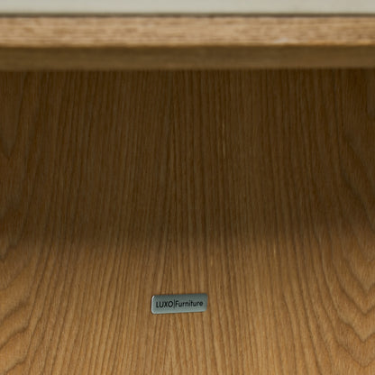 Close-up of wooden furniture surface with a LUXO Furniture label