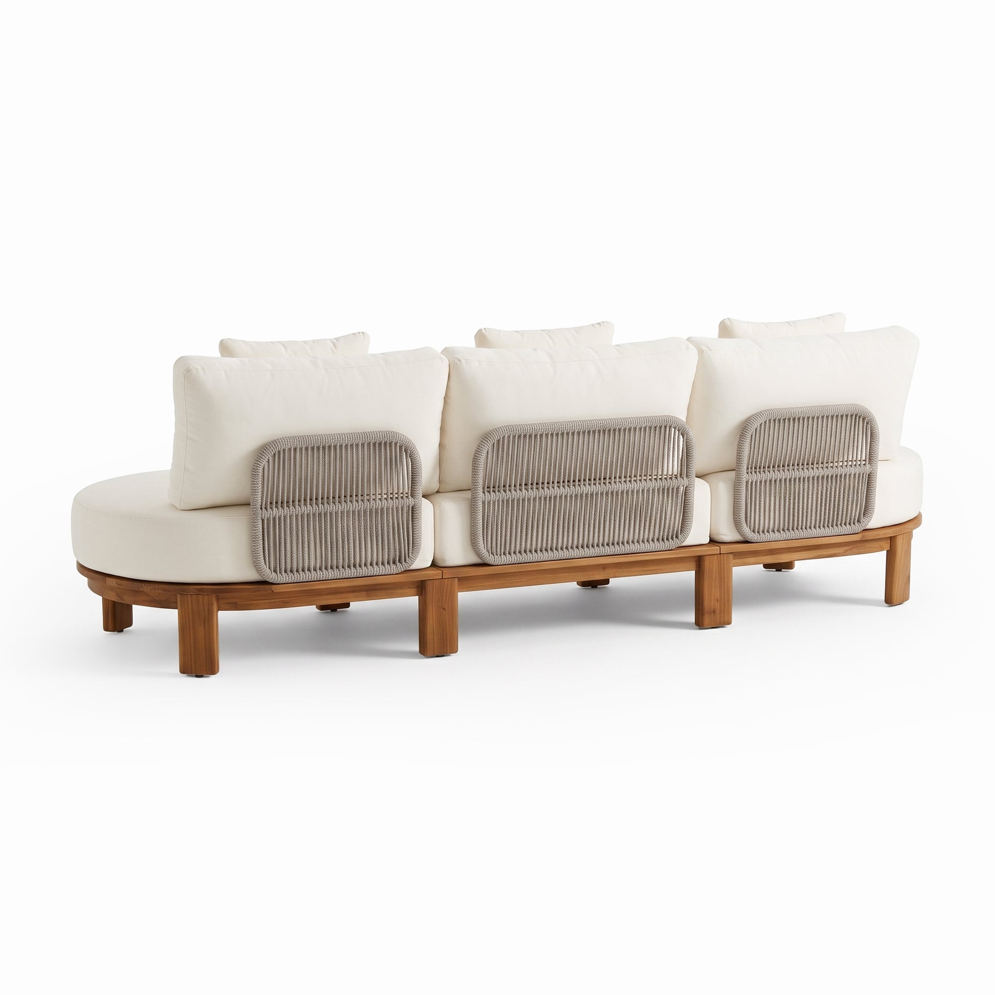 Three-seat sofa viewed from behind with wooden base, cushions, and cane panels on a white background.