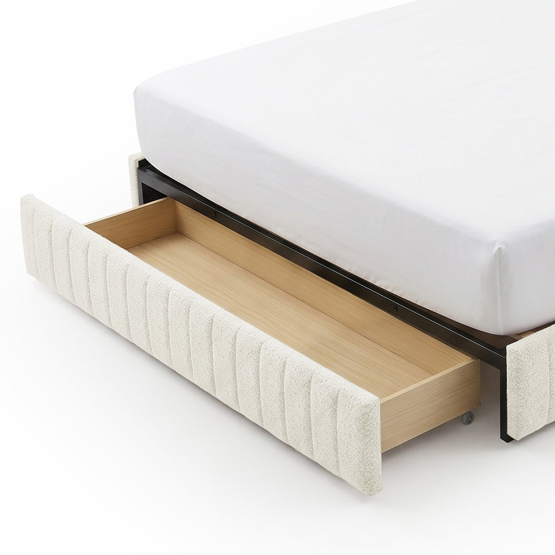 Close-up of under-bed storage drawer in upholstered bed frame on white background
