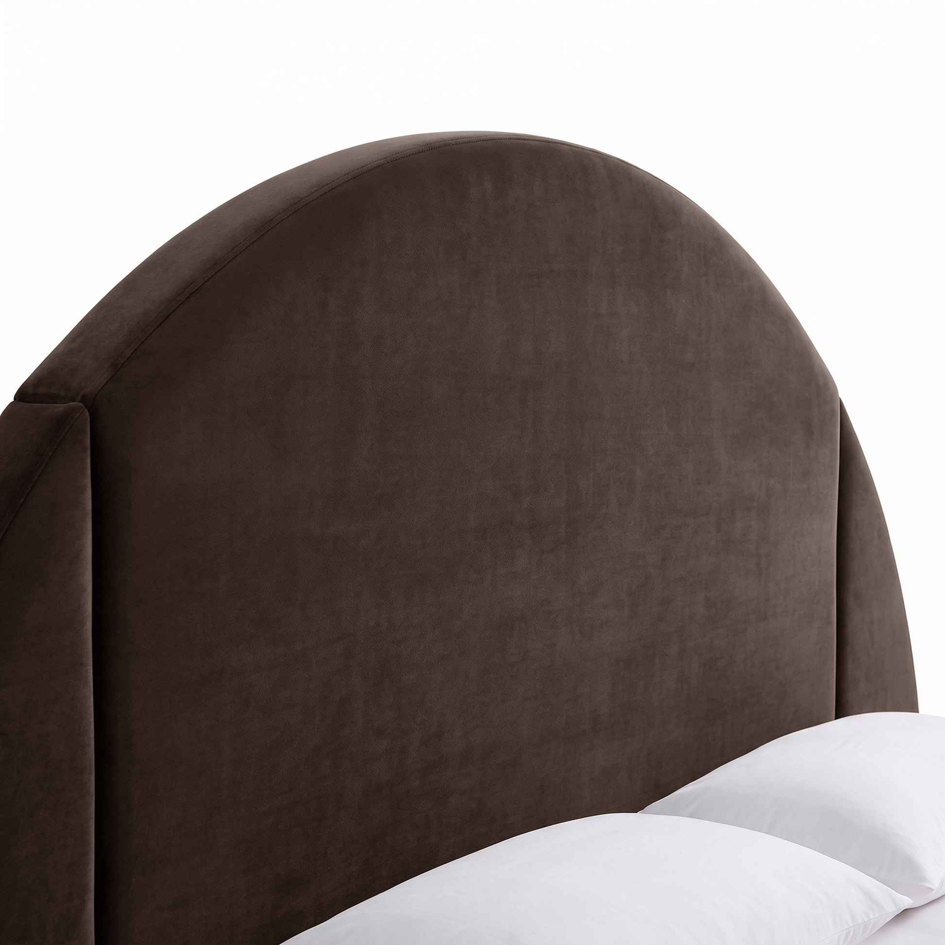 Close-up of the upholstered headboard of a modern bed on white background