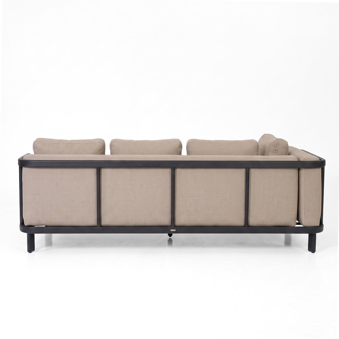 Back view of a modern beige sofa on white background.