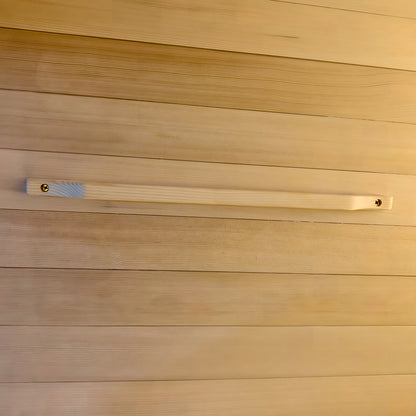 Wooden handle mounted on a wooden paneled wall