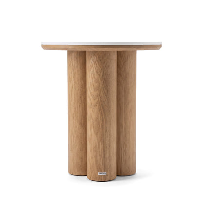 Modern round wooden side table on a white background