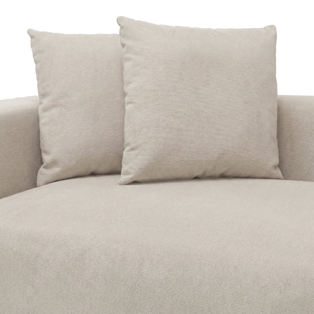 Upper section of beige upholstered sofa with two cushions on white background