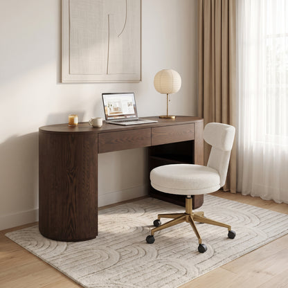 Dark wood desk and chair arranged in a styled modern home office