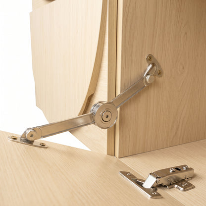 Close-up of cabinet hinge and soft-close hardware on wooden furniture