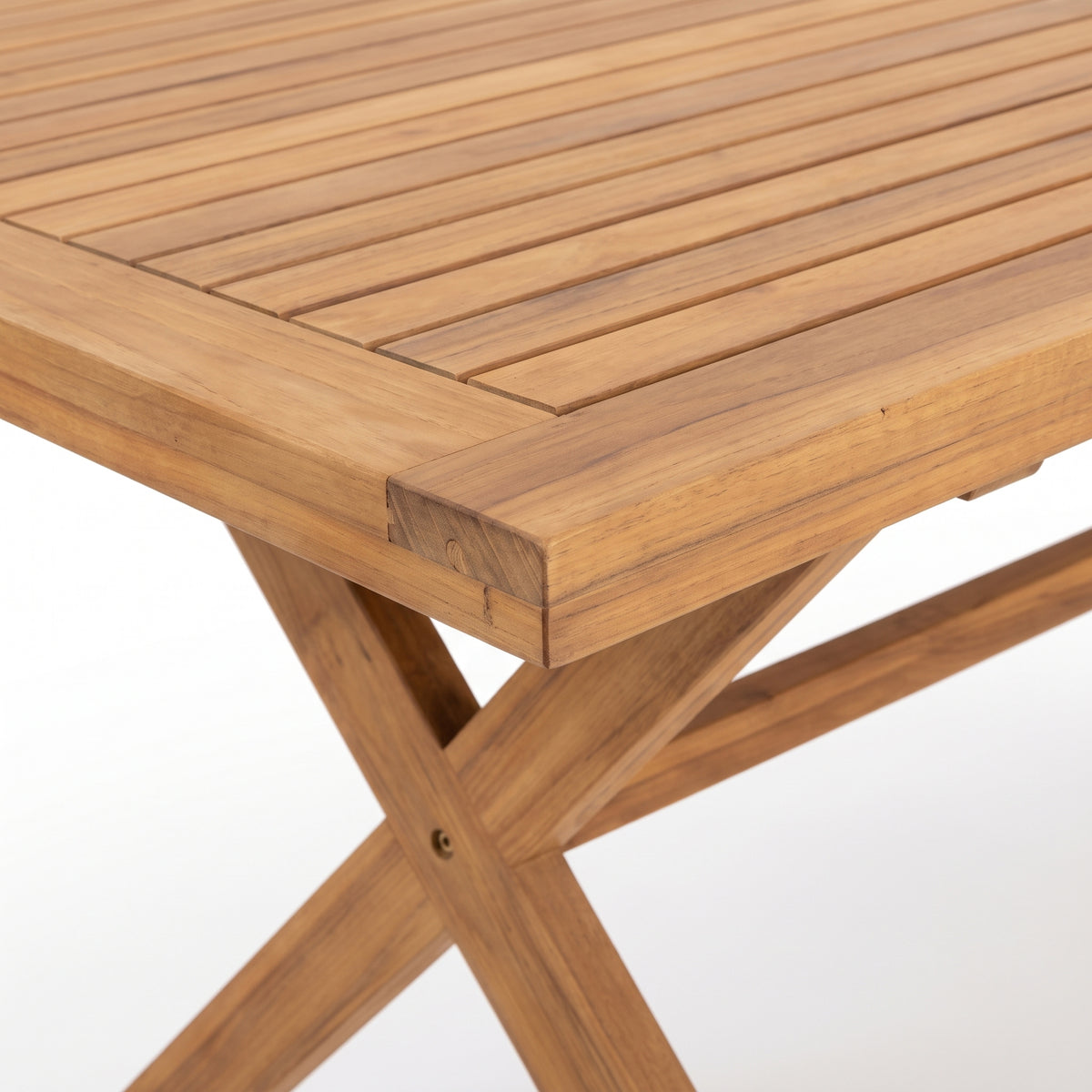 Close-up of a wooden table corner and legs on a white background