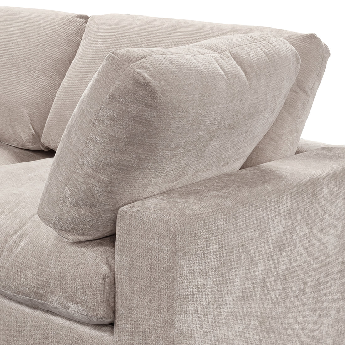Close-up of beige sofa corner and cushions on white background