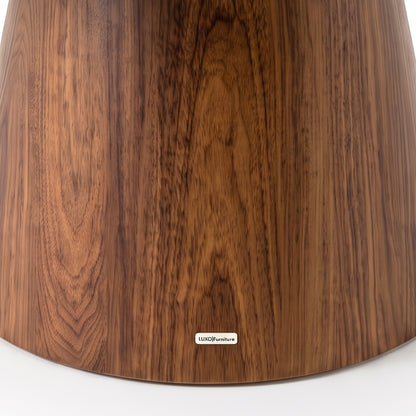 Close view of a wooden furniture base with visible wood grain on white background
