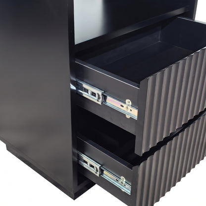 Close-up of partially opened drawers on a black cabinet against a white background
