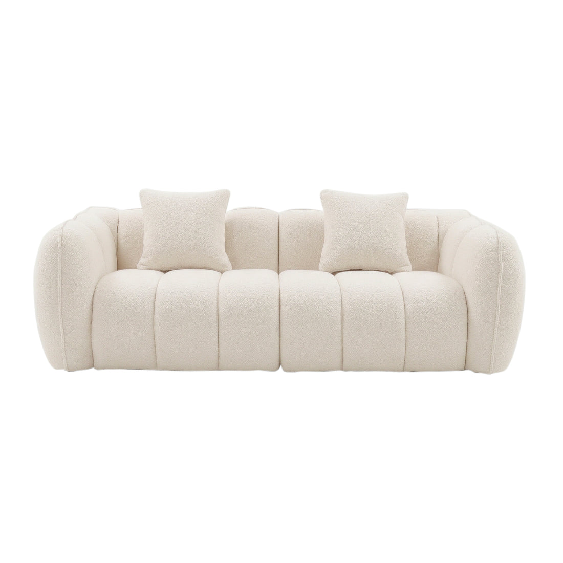 Contemporary cream-colored sofa with tufted upholstery and two cushions on white background