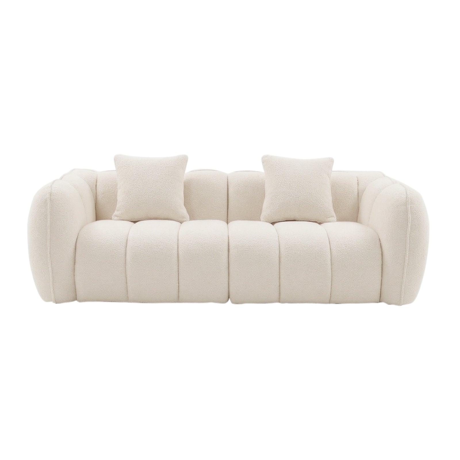 Contemporary cream-colored sofa with tufted upholstery and two cushions on white background