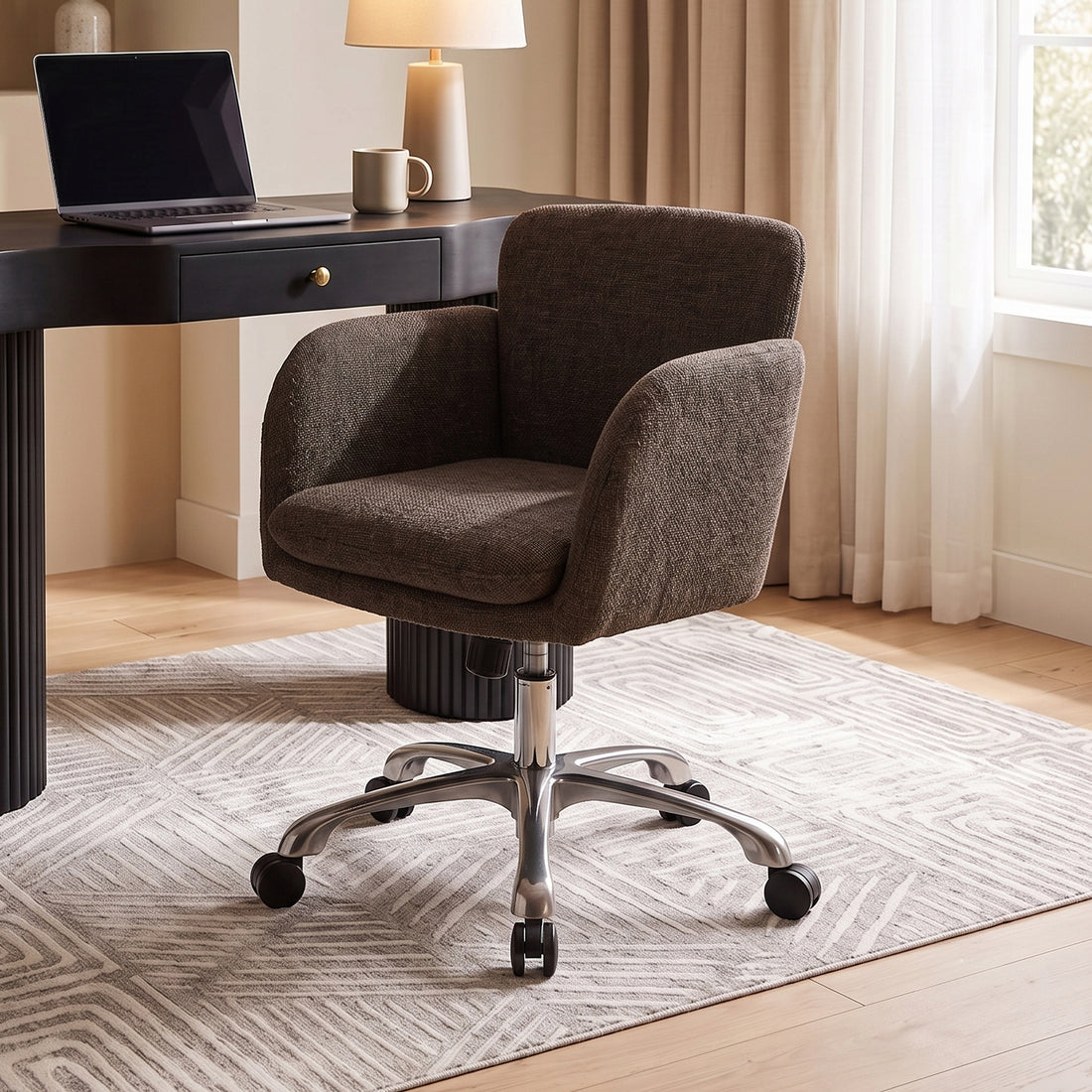 Brown upholstered office chair in a home office with desk and lamp