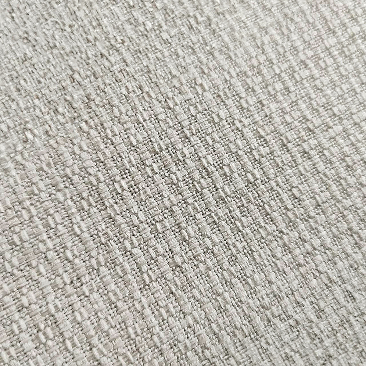 Close-up of light beige woven upholstery fabric texture
