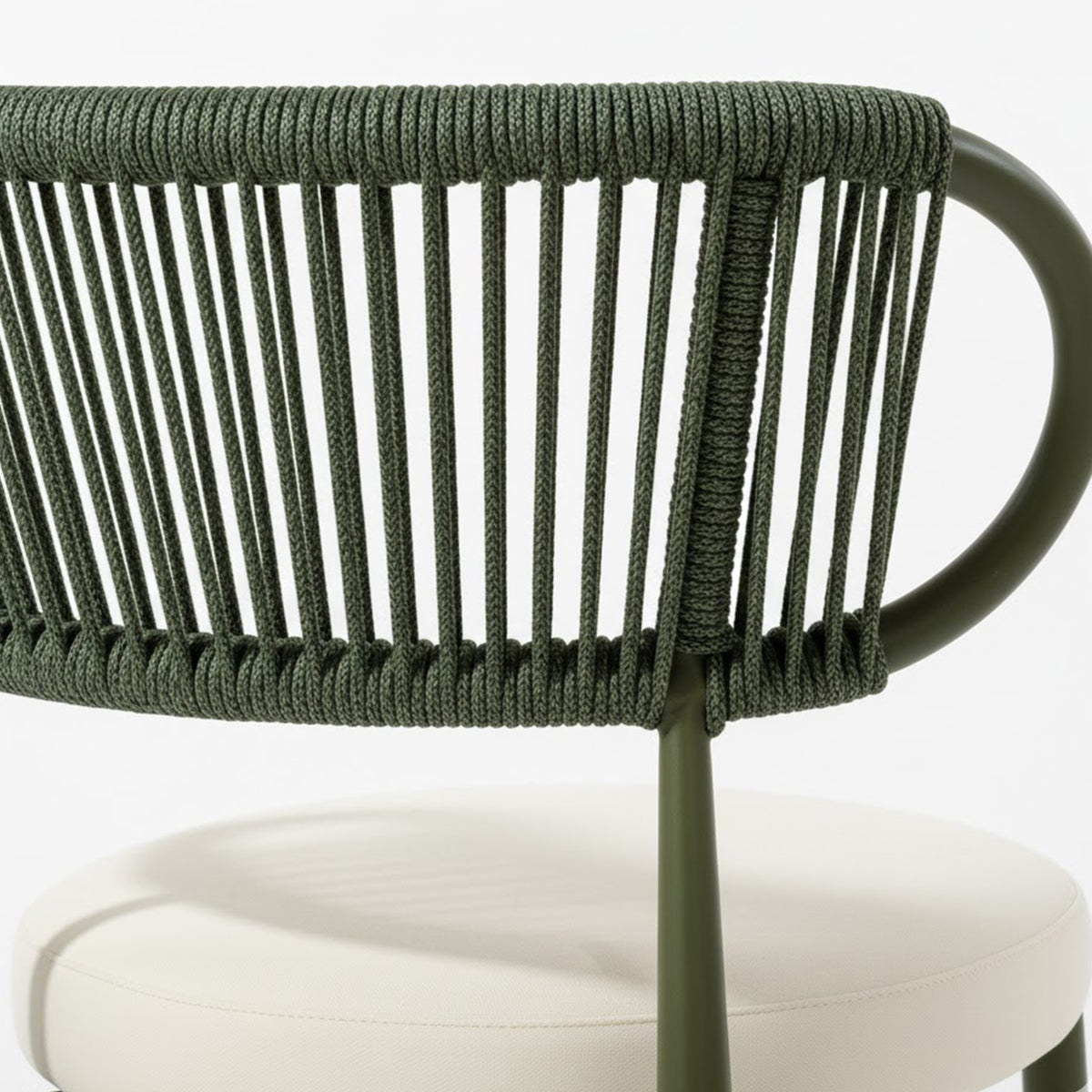 Cabria 9 Piece Sintered Stone Outdoor Dining Set in Green features a modern chair with an olive green, powder-coated metal frame and a backrest of vertical rope strands, paired with an off-white cushion.