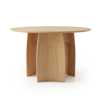 Round wooden dining table on a white background