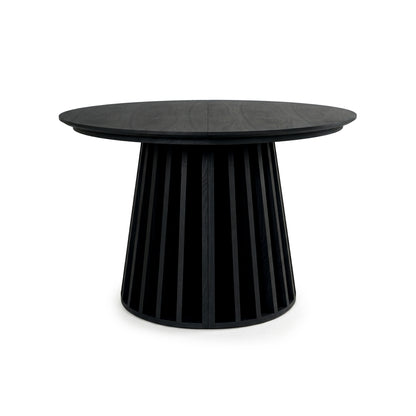 Black round table with slatted base on white background