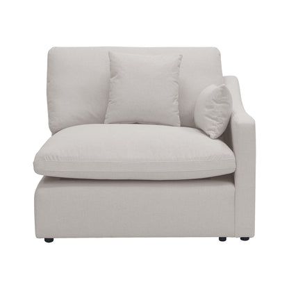 Light beige armless sectional chair with pillows on a white background
