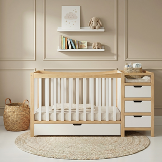 Baby crib with attached changing table in a styled nursery room