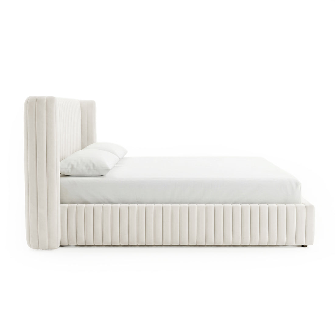 Side view of upholstered bed on white background