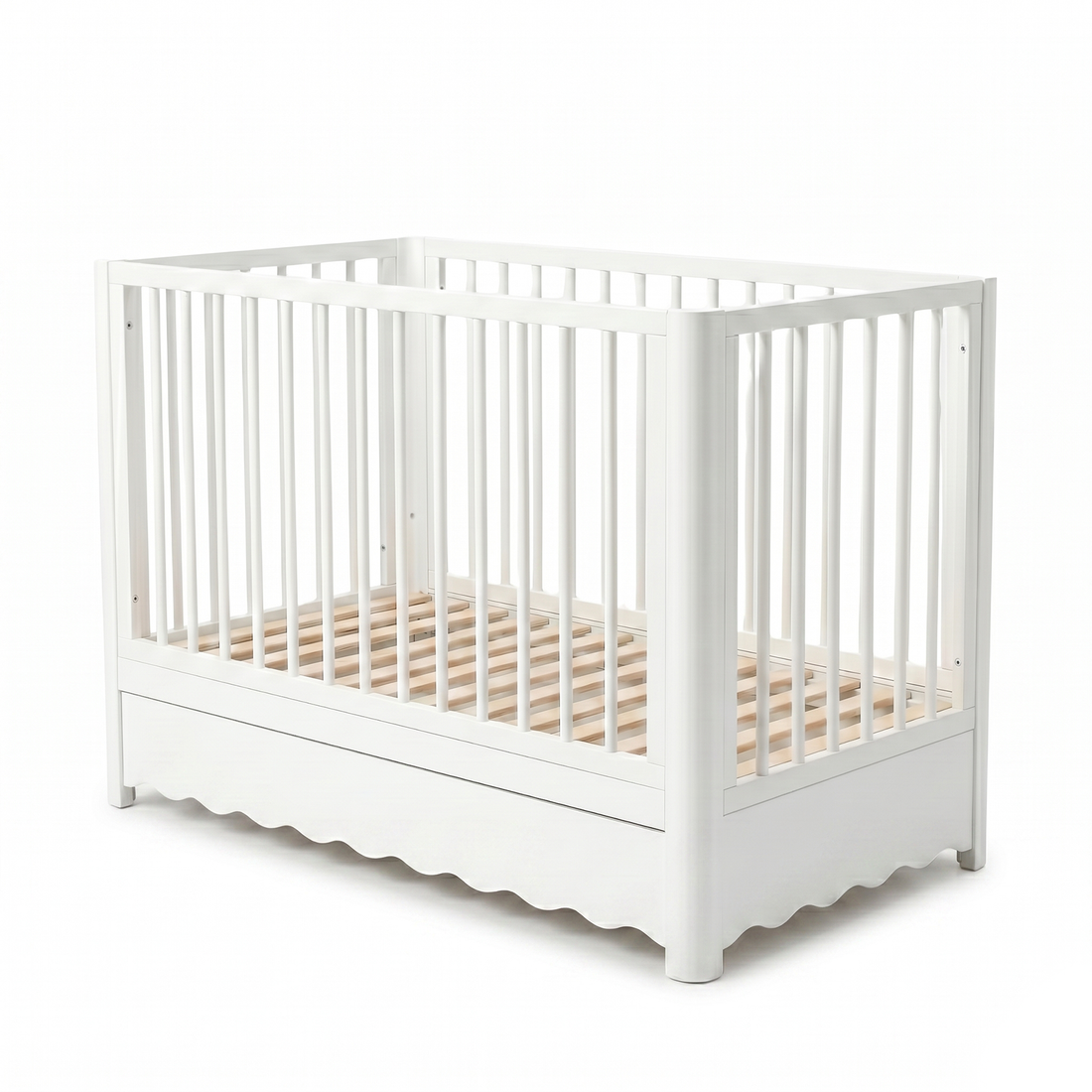 White baby crib on white background with vertical slats and minimalist design