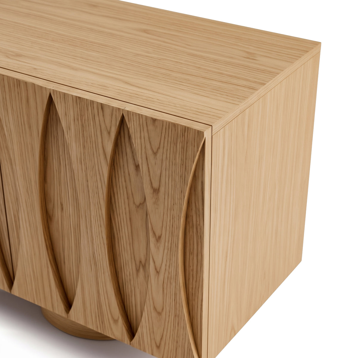 Modern wooden cabinet with carved front details on white background