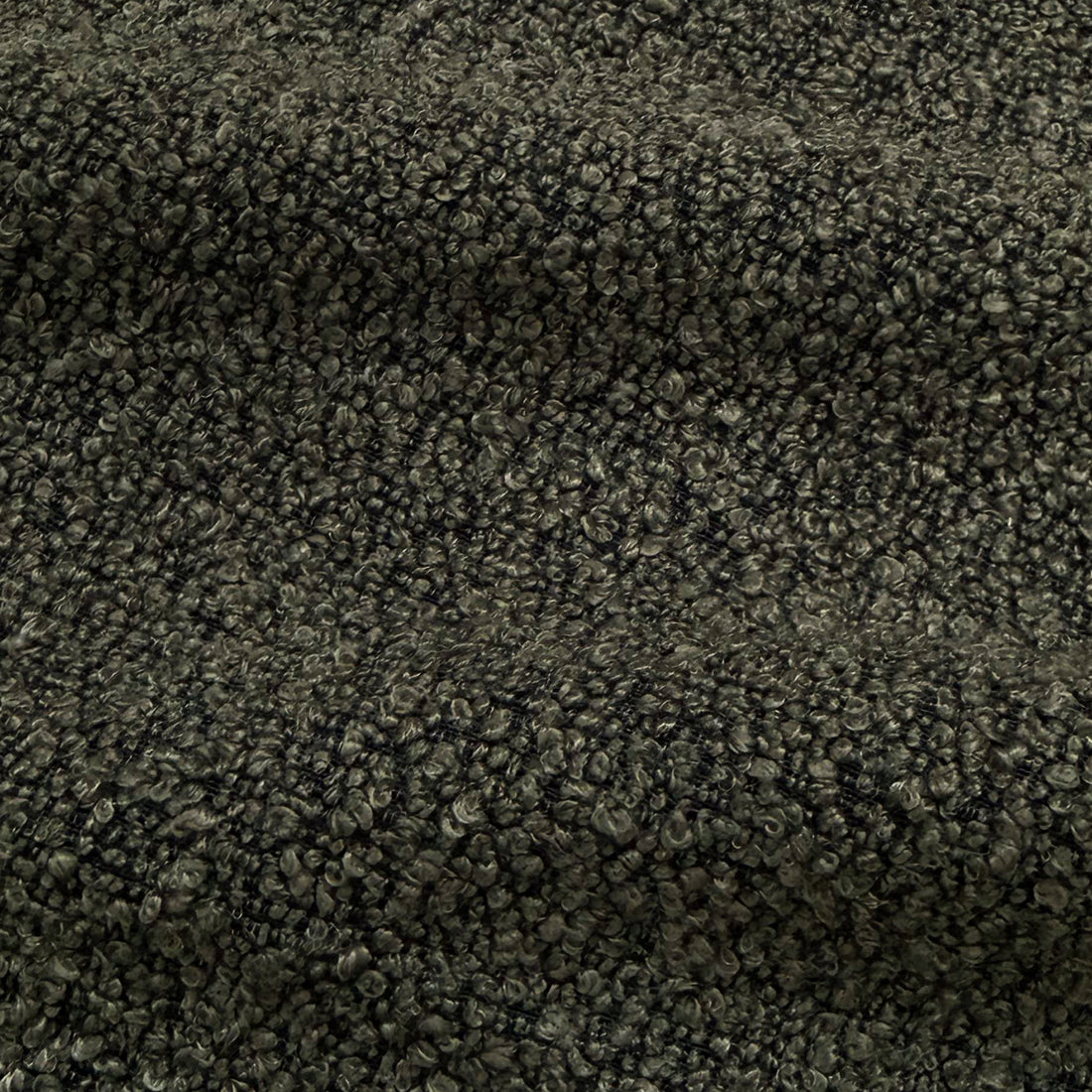 Extreme close-up of dark gray boucle fabric texture