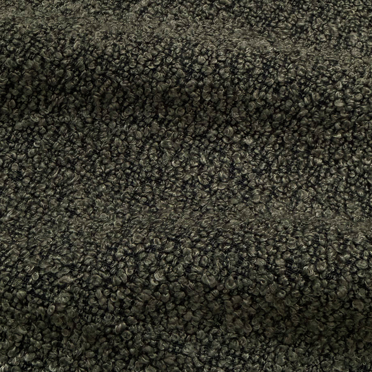 Extreme close-up of dark gray boucle fabric texture