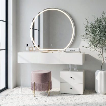 White vanity table with LED-lit round mirror, pink stool, and side cabinet in a bright living space