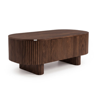 Oval dark wood coffee table with fluted sides on a white background