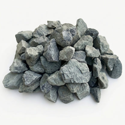 Neatly arranged pile of grey decorative stones on a white background