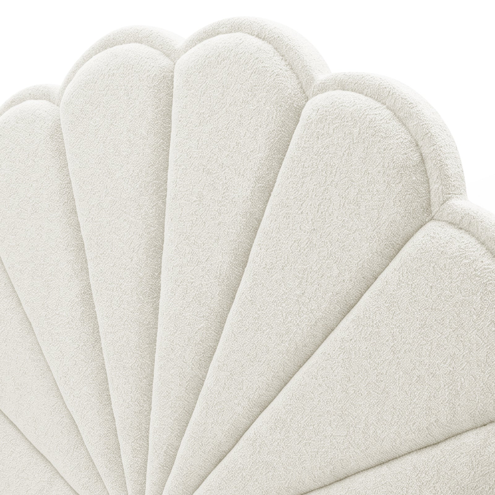 Close-up of scalloped upholstered headboard texture in off-white